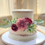 A sophisticated and modern 2-tier wedding cake with minimalist textures designed by Lezat Cakes for an intimate urban micro-wedding in Los Angeles.