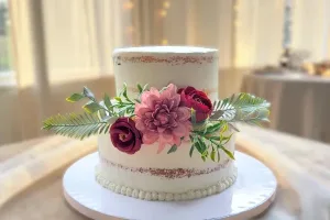 A sophisticated and modern 2-tier wedding cake with minimalist textures designed by Lezat Cakes for an intimate urban micro-wedding in Los Angeles.