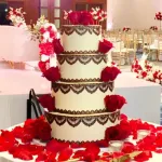 A stunning, meticulously detailed custom wedding cake designed by Haryanti at Lezat Cakes in Los Angeles, perfect for couples with dietary preferences.