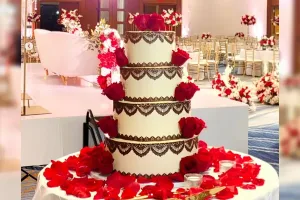 A stunning, meticulously detailed custom wedding cake designed by Haryanti at Lezat Cakes in Los Angeles, perfect for couples with dietary preferences.